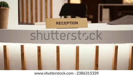 Reveal of reception sign travel accommodation hotel lobby modern clean reception counter. Empty hospitality industry check in front desk in stylish luxurious resort lounge interior