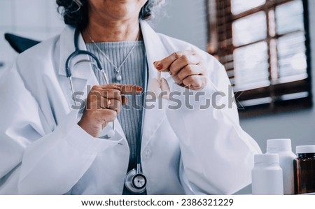 Female doctor holding virtual Lungs in hand. Handrawn human organ, copy space on right side, raw photo colors. Healthcare hospital service concept stock photo
