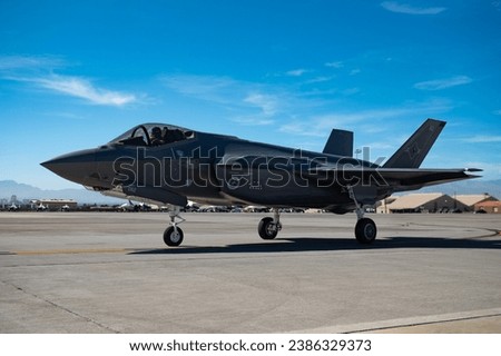 A Royal Australian Air Force (RAAF) F-35 taxis to take off for a training mission at Nellis Air Force Base, Nevada, Nov. 2, 2023.  Royalty-Free Stock Photo #2386329373