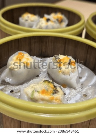 a picture of various dim sum foods