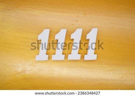 The golden yellow painted wood panel for the background, number 1111, is made from white painted wood.