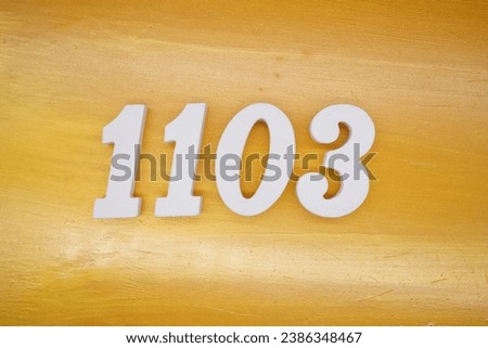 The golden yellow painted wood panel for the background, number 1103, is made from white painted wood.