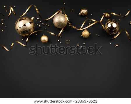 gold christmas balls on black background