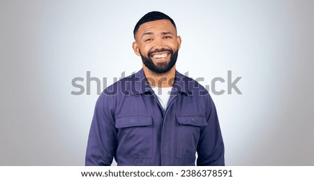 Portrait, laugh and happy business man in studio with humor, joke or funny personality on grey background. comic, face and isolated entrepreneur with confidence, positive attitude or feel good mood Royalty-Free Stock Photo #2386378591