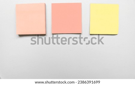 Blank three colorful sticky note on gray pastel background. Place for text. Stationery template.Copy space.