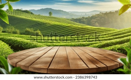 Circle wooden table top with blurred tea plantation landscape against blue sky and blurred green leaf frame Product display concept natural background  Royalty-Free Stock Photo #2386398743