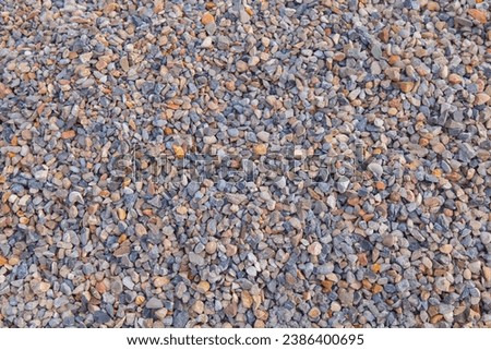 background close-up of piles of rubble, close-up of gray granite gravel background for concrete mix in industrial construction