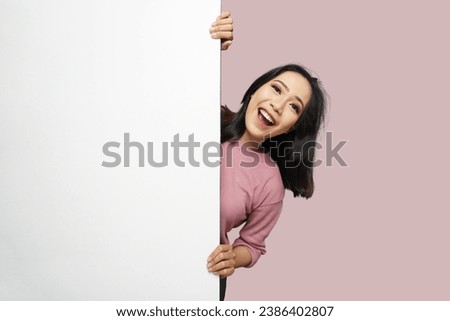 Beautiful Asian Girl Peeking Isolated Background Royalty-Free Stock Photo #2386402807