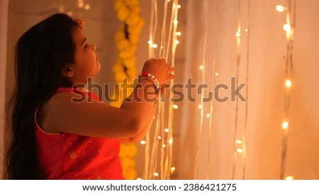 Happy Indian Kid girl Celebrating diwali