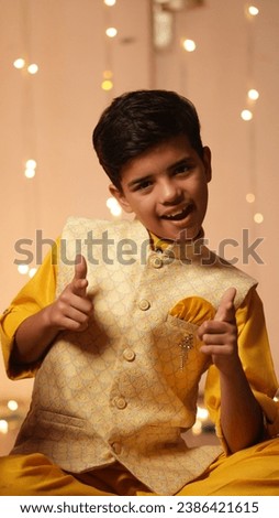 Happy Indian Kid Boy Celebrating Diwali,Holding gifts
