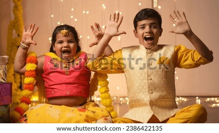 Happy Indian Kids celebrating diwali,holding gift boxes