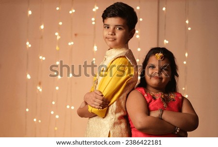 Happy Indian Kids celebrating diwali,holding gift boxes