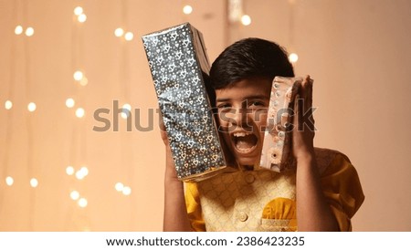 Happy Young Indian kid boy celebrating diwali