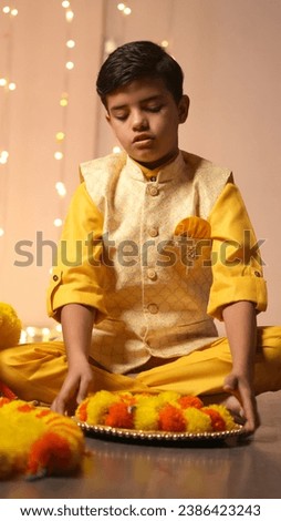 Happy Young Indian kid boy celebrating diwali