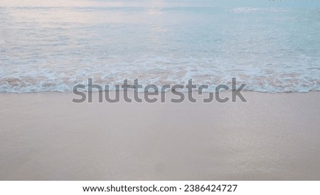 A summer vacation. Soft beautiful ocean wave on sandy beach. Soft focus. Copy space. Background.