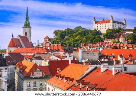 Bratislava, Slovakia. Panoramic rooftop view of the Castle, the cathedral and the old town square. Royalty-Free Stock Photo #2386440679