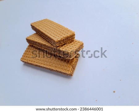 Close up photo of chocolate wafer on white background