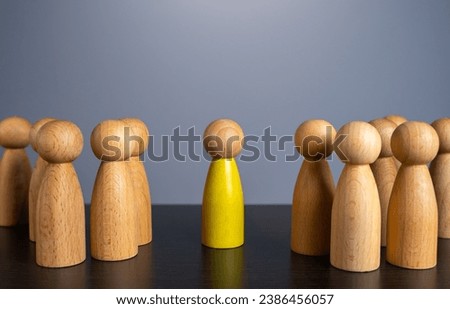 A person who stands out from the crowd. Stand out from others. Chosen, talented. To be different. Ambitions and aspirations. Royalty-Free Stock Photo #2386456057