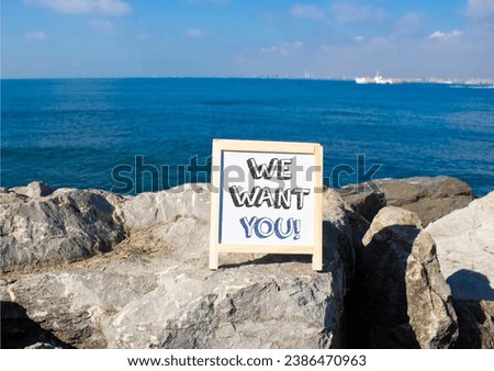 We want you symbol. Concept words We want you on white chalk blackboard blocks. Beautiful sea background. Business and We want you concept. Copy space.