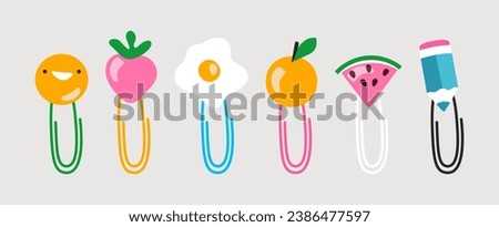 Set of colorful paper clips decorated with smile face, strawberry, watermelon slice, pencil. Cute childish stationery clip art. Flat doodle vector illustration