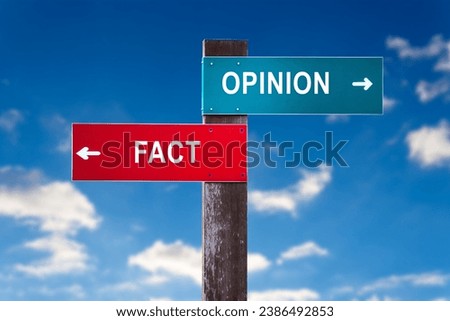 Fact versus opinion - Road sign with two options Royalty-Free Stock Photo #2386492853