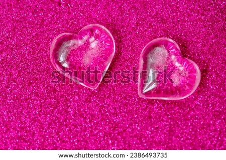 pink background two hearts valentines day closeup