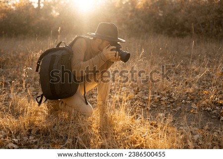 Arabic young man traveler and photographer, taking pictures on the sunset, sunrise. Copy space