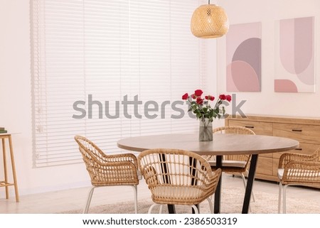 Stylish dining room interior with comfortable furniture