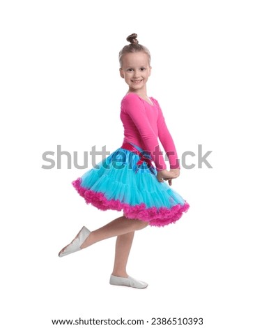 Cute little girl in costume dancing on white background