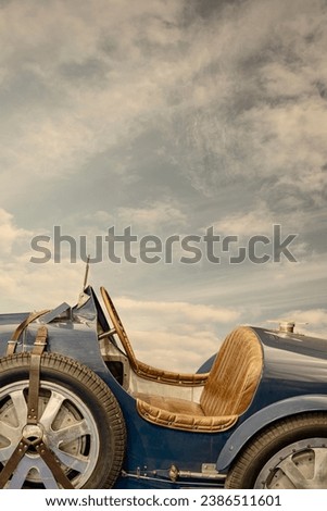 Retro styled image of a classic French sports car of the early twentieth century Royalty-Free Stock Photo #2386511601