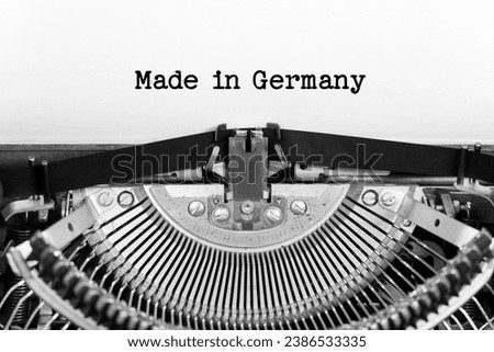 Made In Germany phrase closeup being typing and centered on a sheet of paper on old vintage typewriter mechanical
