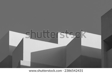 Modern house Building with Sunlight and Shadow on concrete wall surface in Perspective low angle view, Geometric Architecture background in Minimal with Black and White style