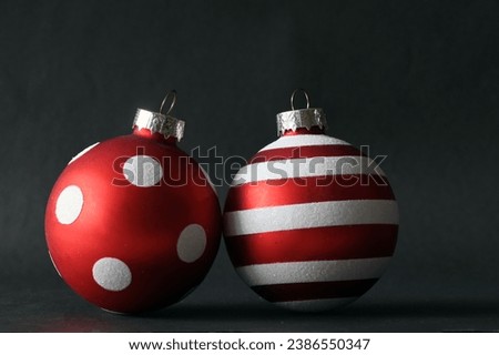 Christmas red baubles on a black background.