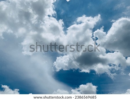 The weather is nice and hot causing white cumulus clouds It looks like a big eagle at Bangkok, Thailand.no focus