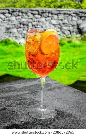 Close-Up of Aperol Spritz Cocktail.  Ideal for beverage, travel, or summer-themed projects, this high-resolution image captures the effervescence and sophistication of the popular cocktail. 