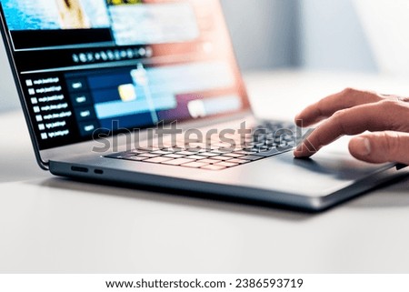 Video edit with computer. Film production student making a movie with editor in laptop. Editing software with special effects in visual studio. Content creator and digital multimedia designer. Royalty-Free Stock Photo #2386593719