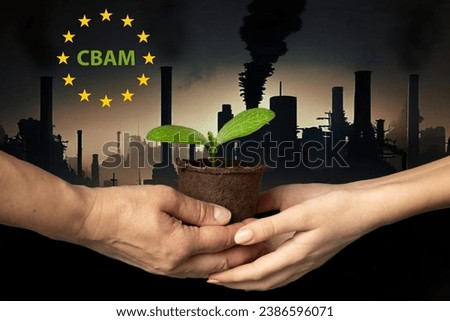 Hands of adult and child hold peat pot with green sprout of plant against backdrop of industrial cityscape with smoking chimneys and dark sky. CBAM. EU Carbon Border Adjustment Mechanism. Ecology