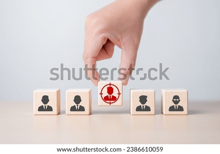 Target customer, Buyer individual person, Client segmentation, Job recruitment concept. Specific buyer marketing, customer base strategies. Hand pick wooden cubes with focus on target customer icons. Royalty-Free Stock Photo #2386610059