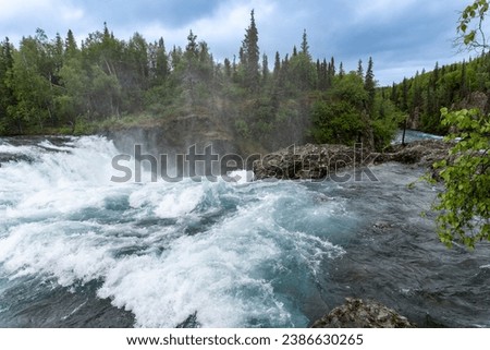Lake Clark National Park in Alaska. Tanalian Falls and river. Spruce trees, rugged mountains and popular day hike area near Port Alsworth. Royalty-Free Stock Photo #2386630265