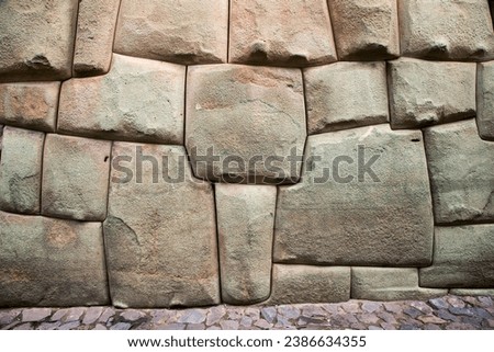 Inca stone walls in Cusco, Peru, a remarkable example of Inca architecture and craftsmanship Royalty-Free Stock Photo #2386634355