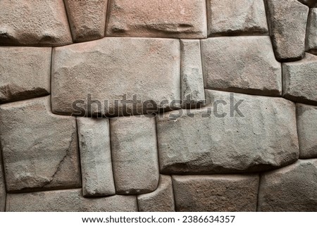 Inca stone walls in Cusco, Peru, a remarkable example of Inca architecture and craftsmanship Royalty-Free Stock Photo #2386634357