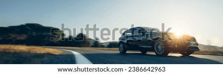 rental car in spain mountain landscape road at sunset Royalty-Free Stock Photo #2386642963