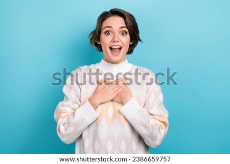 Photo of astonished nice person open mouth arms touch chest cant believe isolated on blue color background