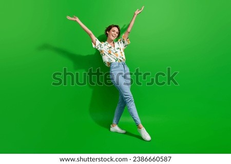 Full body photo of young charming girl raised palms up goal achieved celebrating approved university isolated on green color background