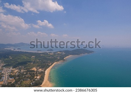 Aerial view blue sea and white long beach at Kwang beach Krabi.
scenery white sand beach.
Gradient blue sea background. 
dramatic nature colorful seascape.