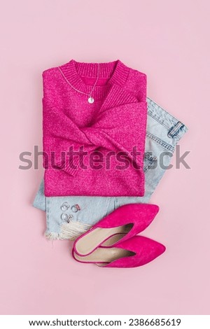 Fashion spring or autumn outfit. Pink jumper and shoes with jeans. Women's stylish and elegant clothes with accessory and jewelry. Fashionable look. Flat lay, top view, overhead.
