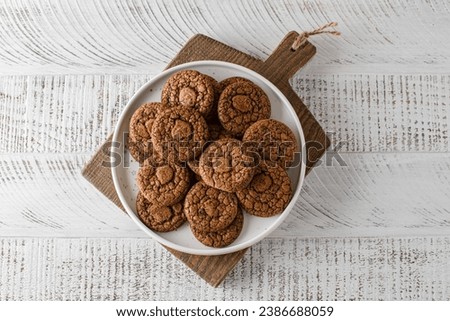 chocolate cookies on a white wooden background. High quality photo
