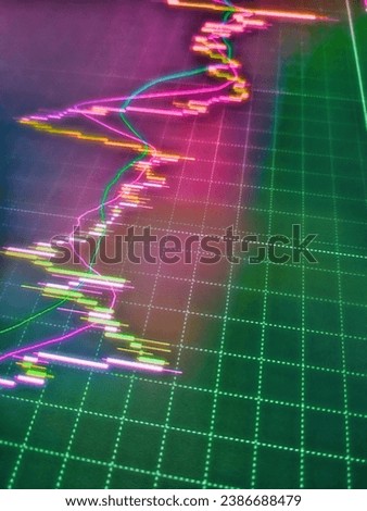 Businessman analyzing investment charts with laptop. Stock market chart, graph on blue background. Screen background showing stock market graphs, funds and investments