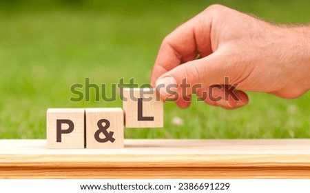 hand holding wooden cube with letter L. P and L concept of governance and social environment Royalty-Free Stock Photo #2386691229