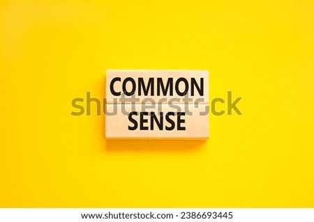 Common sense symbol. Concept words Common sense on beautiful wooden block. Beautiful yellow table yellow background. Business, motivational common sense concept. Copy space. Royalty-Free Stock Photo #2386693445